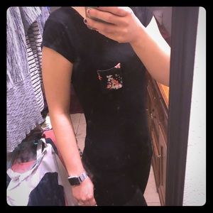 Beautiful black top with flower accent pocket